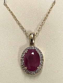 Ladies 10KT Gold Genuine Ruby/Diamond Pendant With 18" Necklace 